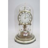 A 20th century anniversary clock, housed under a glass dome, h.30cm