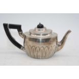 A Victorian silver bachelors teapot, of half-reeded oval form with ebonised finial and handle, 10.