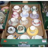 A box of porcelain coffee cans and saucers to include Wedgwood and Royal Worcester