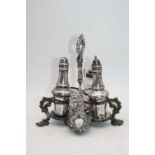 A Victorian silver plated five bottle cruet stand, with four associated components, having silver