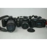 A Fujifilm Finepix SL camera, with Super EBC Fuginon lens; together with a Canon E0 5000 camera (