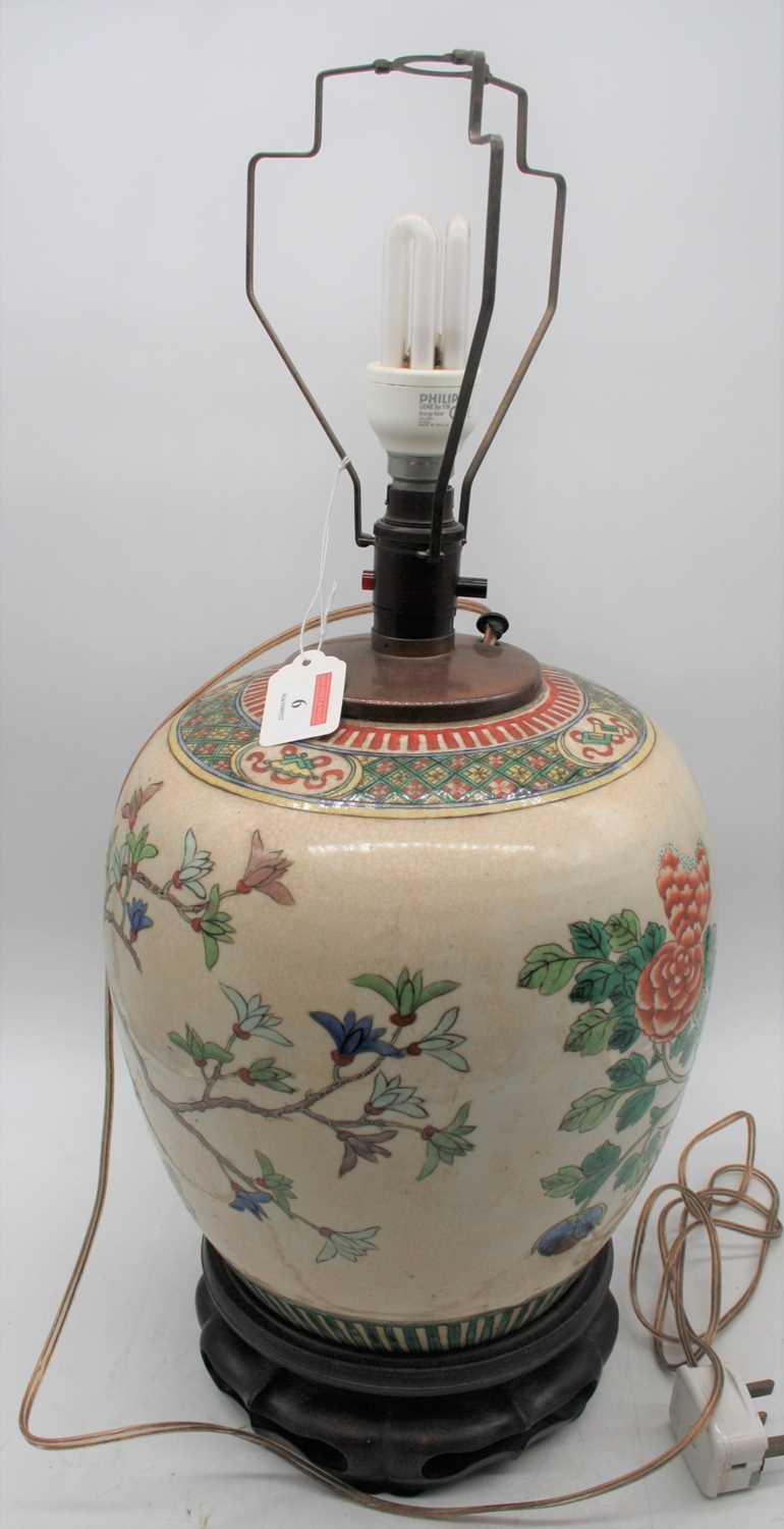 A Chinese export porcelain jar, later converted to a table lamp, enamel decorated with birds amongst