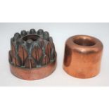 A Victorian copper jelly mould, inscribed DW and numbered 23, h.11cm; together with one other (2)