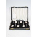 A set of six Elizabeth II silver coffee bean spoons, in fitted case