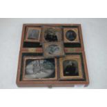 A collection of Victorian daguerreotypes, being portrait examples, in associated mahogany boxAge