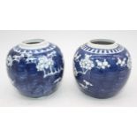 A pair of Chinese porcelain jars, each in the Prunus pattern, h.12cmMinor marks to one base.