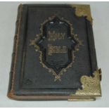 A leather and brass bound Holy Bible, with the Commentaries of Scott & Henry, by Rev. John Edie,