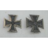 A post-WWII German Iron Cross, with pin back; together with one other similar example (2)