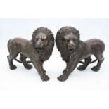 Two bronzed models of lions, h.24cm