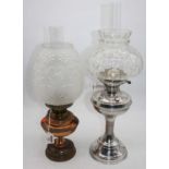 A copper oil lamp, having a floral moulded and frosted glass shade, overall h.49cm; together with