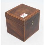 A George III mahogany and crossbanded tea caddy, having kite shaped ivory escutcheon, w.12cm Ivory