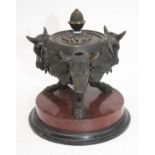 A bronze censor, the cover with acorn finial, the body with three bulls heads with ivy leaf