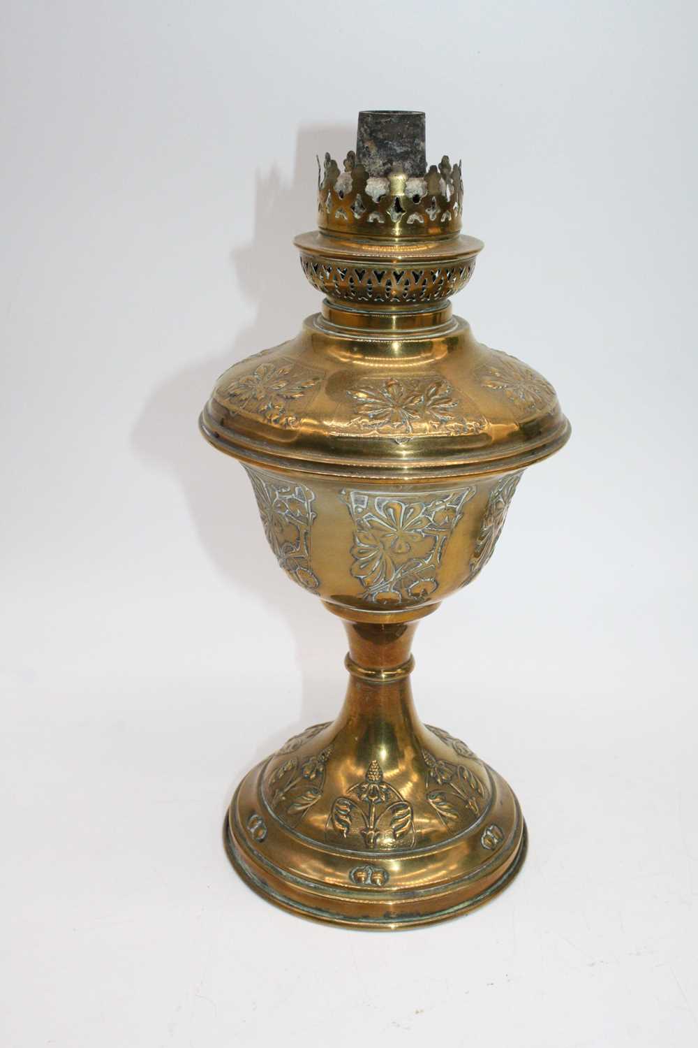 A 19th century repousse decorated brass oil lamp, h.27cm; together with two others (3) - Image 2 of 3