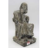 A plaster figure of a seated man upon a square plinth, h.30cm