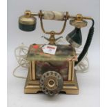 An onyx and brass rotary dial telephone, h.27cm