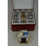 A set of six Preziosi glasses, each with silvered Greek Key borders, in leather case; together