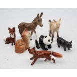 A collection of seven Beswick figures, to include donkey foal No.2110, Vietnamese pot-bellied piglet