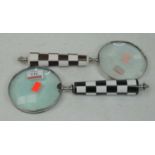 A pair of reproduction oversize magnifying glasses, each having chequered handles, length 27cm