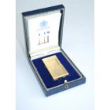 A Dunhill of London gilt metal pocket cigarette lighter, in fitted box