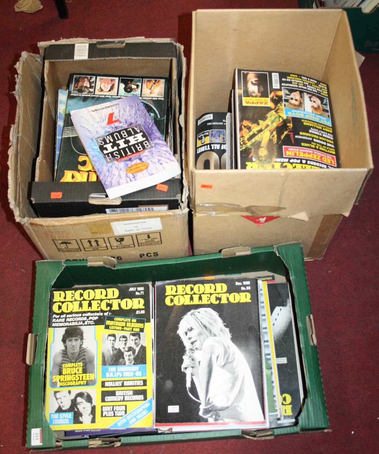 Three boxes of books and magazines relating to pop music