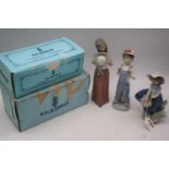 A Lladro porcelain figure of a girl, height 24cm, boxed, together with two others