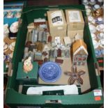 A box of miscellaneous items to include resin buildings and Wade