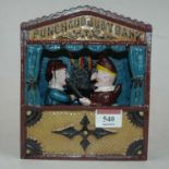 A reproduction cast iron novelty Punch & Judy money-box, h.18cm