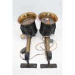 A pair of early 20th century black painted and brass coach lamps, with wall brackets, later