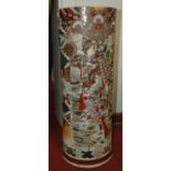 A Japanese earthenware stick stand, typically decorated with figures within landscapes, h.62cm