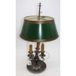 A 19th century silver plated three-branch table lamp, later converted for electricity, having a