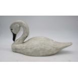 A carved pine model of a swan, h.21cm