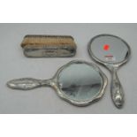 Two 20th century silver backed hand mirrors, together with two silver backed brushes (4)