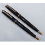 Two Parker Victory fountain pens, one in deep burgundy, the other in midnight blue, both with gold