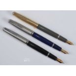 Three Parker VS (Vacuumatic / Victory Successor) fountain pens, being blue, black and grey, the