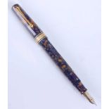 An Omas limited edition Saffron Blue Paragon fountain pen, of faceted form with gold plated trim,