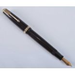 A Parker 35 Duofold fountain pen, in dark brown with gold trim, the barrel engraved PARKER DUOFOLD