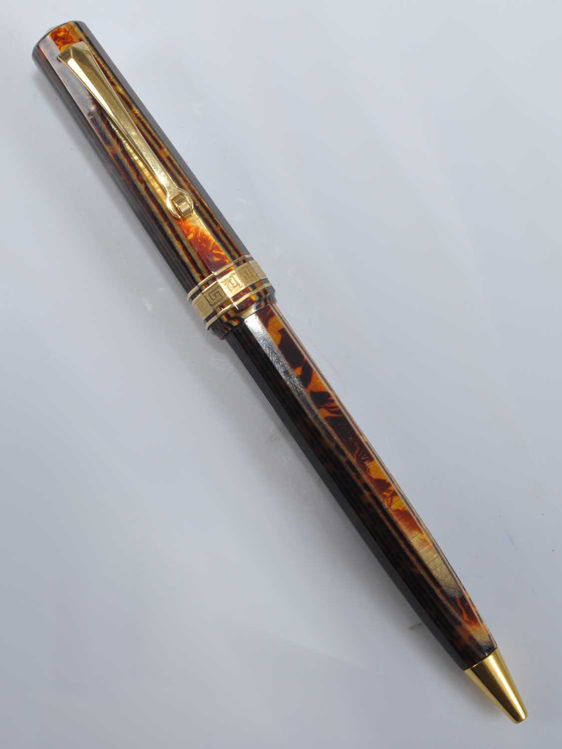 An Omas faceted ballpoint pen from the Arte Italiana Collection, in Arco Brown with gold plated