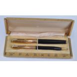 A vintage Parker 51 Empire State special edition fountain pen and pencil set, in black with gold