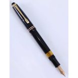 A Montblanc 244 fountain pen, black with gold plated fittings, the blind cap base inscribed 244, the