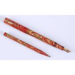 A Waterman 94 Rose Ripple fountain pen and pencil set, the pen barrel marked WATERMAN'S REG US