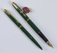 A Parker 75 fountain pen and ballpoint pen set, in malachite green with gold plated fittings, the