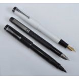 Three Parker pens, being a 25 Epoxy fountain pen in matt black with black trim, the cap engraved