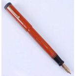 A Thompson replica Parker Lucky Curve fountain pen, in deep orange, the barrel engraved 'GEO. S.