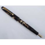 A Pilot Namiki maki-e fountain pen, Japanese lacquer decorated in Plum Blossom design and with kanji