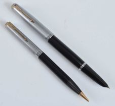 A Parker 51 fountain pen and pencil, in black with rolled silver trim, the fountain pen barrel