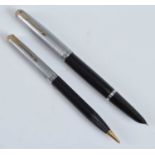 A Parker 51 fountain pen and pencil, in black with rolled silver trim, the fountain pen barrel