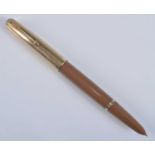 A Parker 51 double jewelled fountain pen, in Buckskin Beige with gold trim, the barrel engraved