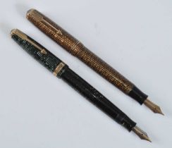 Two Parker Vacuumatic fountain pens, being Golden Web and Emerald Major examples with gold trim,