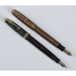 Two Parker Vacuumatic fountain pens, being Golden Web and Emerald Major examples with gold trim,