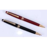 Two Montblanc Meisterstuck ballpoint pens, in black and burgundy with gold plated trim, each